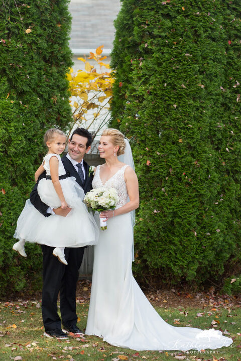 Bride and groom with flower girl